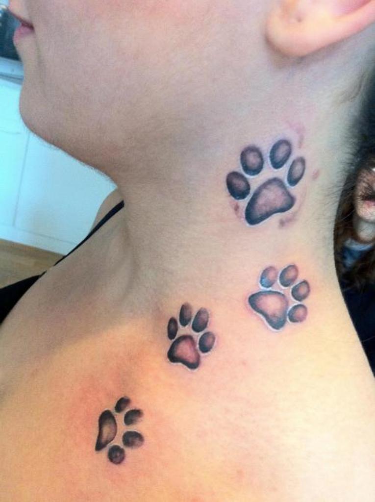 dog paw tattoo behind ear